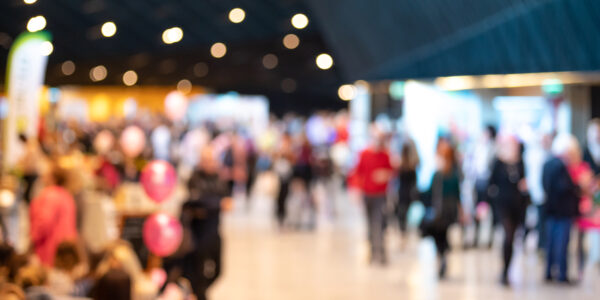 Blurred crowd of people in modern interior during event